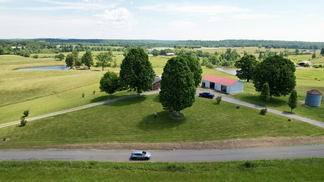 bird's eye view featuring a water view and a rural view