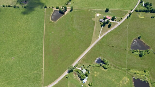 aerial view with a rural view and a water view