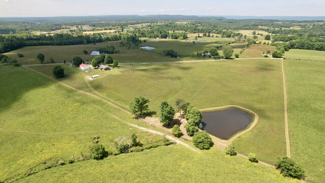 birds eye view of property featuring a rural view and a water view