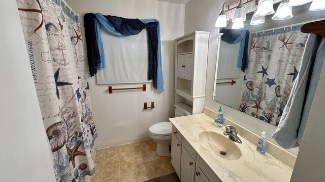 bathroom featuring curtained shower, vanity, and toilet