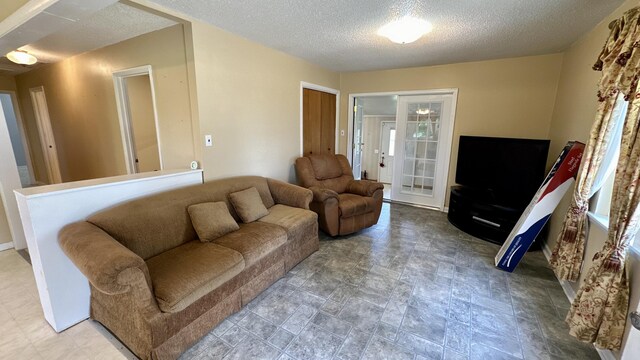 living room with a textured ceiling