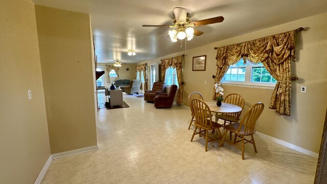 dining space featuring ceiling fan