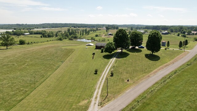 birds eye view of property featuring a rural view and a water view