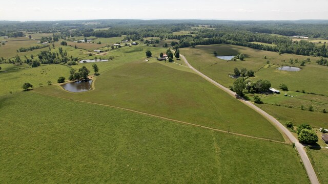 drone / aerial view featuring a rural view and a water view