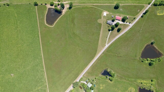 bird's eye view featuring a rural view and a water view