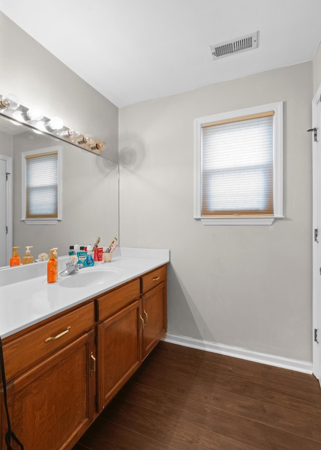 bathroom featuring vanity and hardwood / wood-style flooring