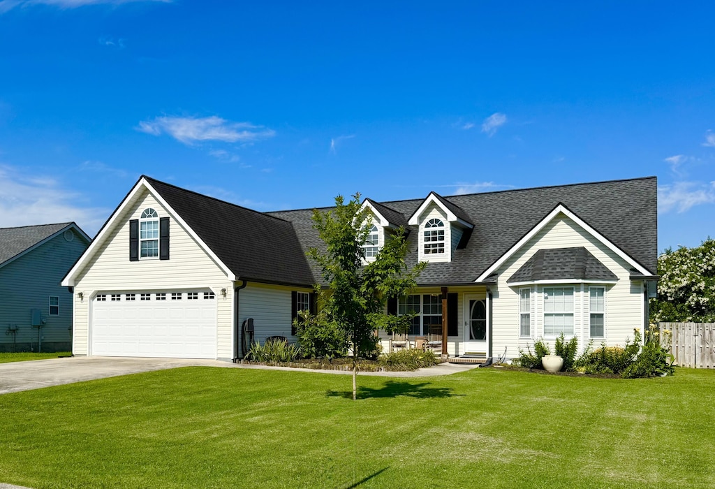 132 Holli Ln, Rossville, GA 30741 - view of front of house featuring concrete driveway, a shingled roof, an attached garage, and a porch