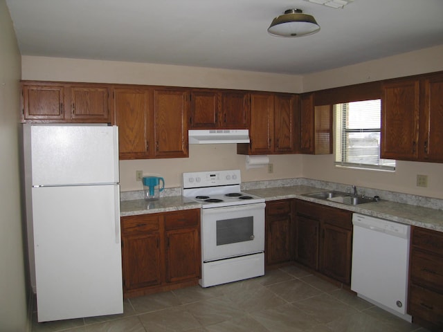900 Stratford Cir NW, Cleveland, TN 37312 - kitchen with white appliances, light countertops, a sink, and under cabinet range hood