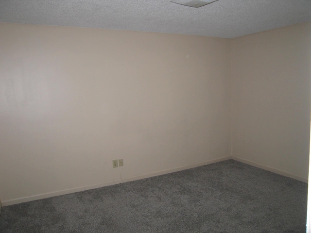 900 Stratford Cir NW, Cleveland, TN 37312 - carpeted empty room featuring a textured ceiling and baseboards