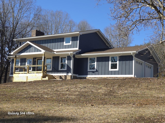 view of front of property featuring a garage and covered porch