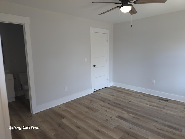 empty room with ceiling fan and light wood-type flooring