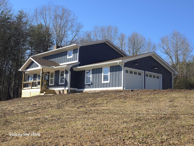 view of front of house featuring a garage and a porch