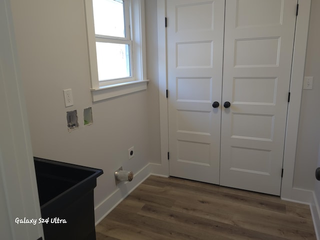 laundry room with hookup for an electric dryer and hardwood / wood-style floors