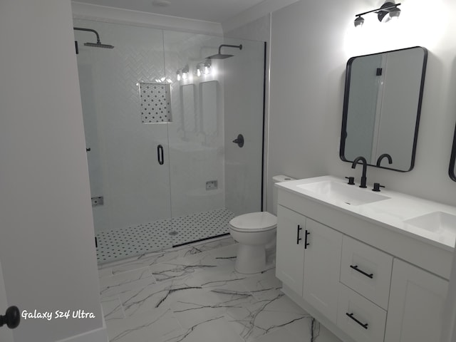 bathroom with vanity, toilet, and a shower with shower door