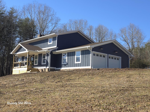 view of front facade with a garage and covered porch