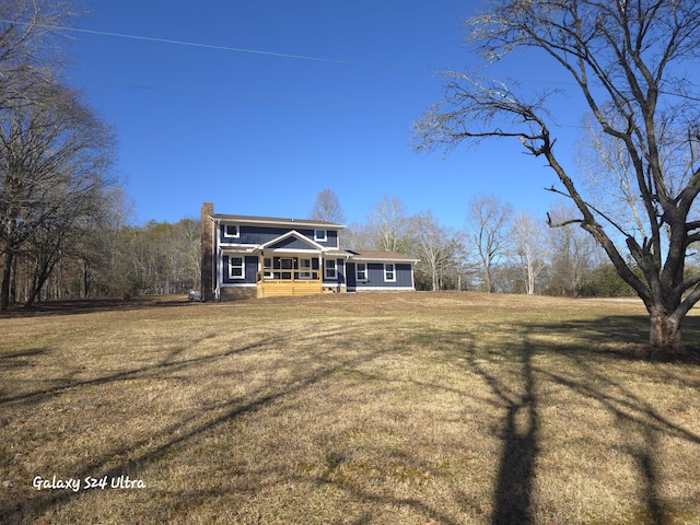 view of front facade with a front yard and a porch