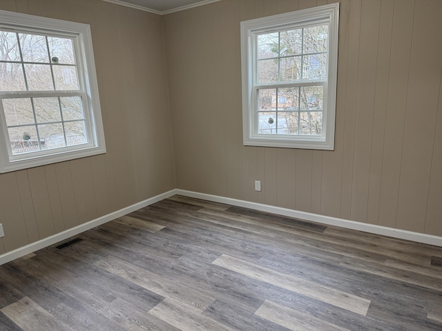 unfurnished room with hardwood / wood-style flooring