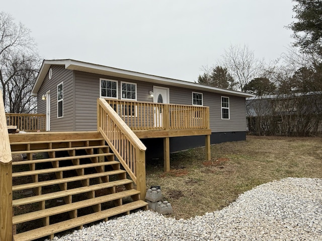 rear view of house featuring a deck