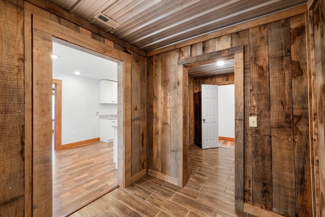 804 Eastanallee Ave, Athens, TN 37303 - hall with wood walls, visible vents, baseboards, and wood finish floors