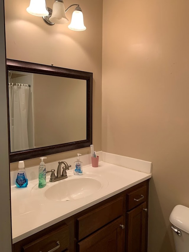 bathroom with vanity and toilet