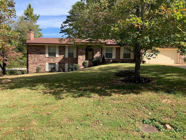 view of front of house with a garage and a front yard