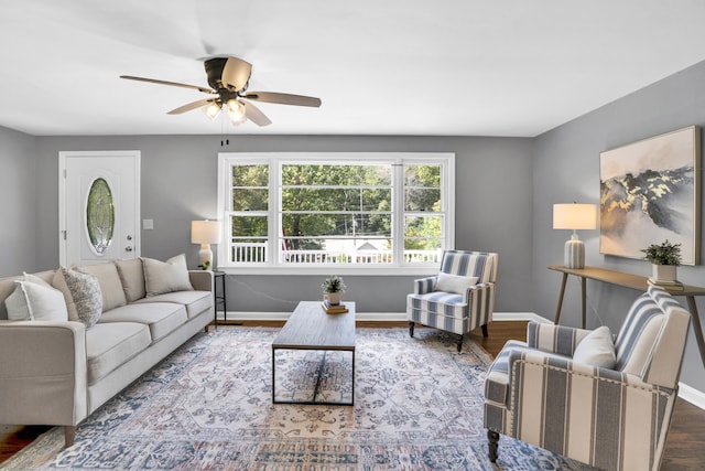 living room with ceiling fan and hardwood / wood-style flooring