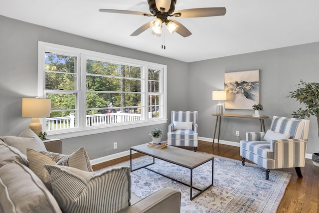 living room with hardwood / wood-style floors and ceiling fan