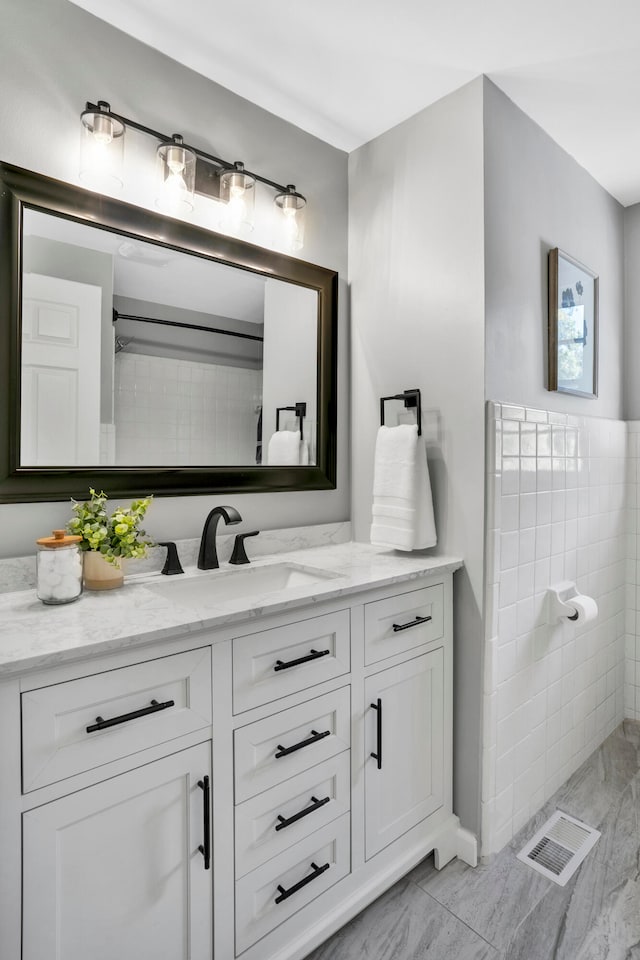 bathroom featuring vanity and walk in shower