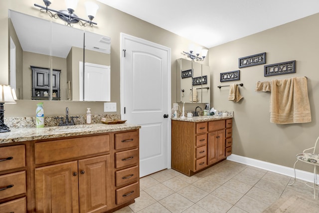 bathroom with tile patterned flooring and vanity