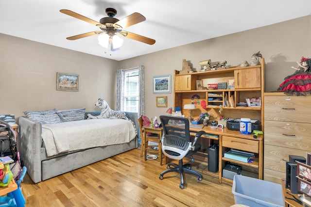 bedroom with light wood-type flooring and ceiling fan