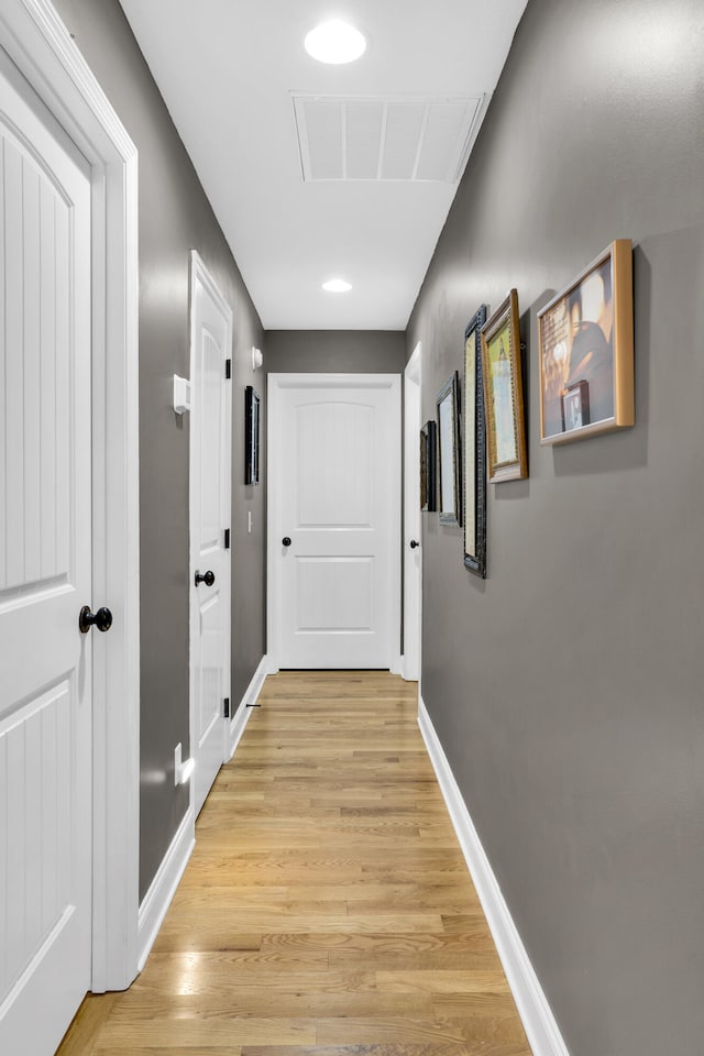 corridor featuring light hardwood / wood-style flooring