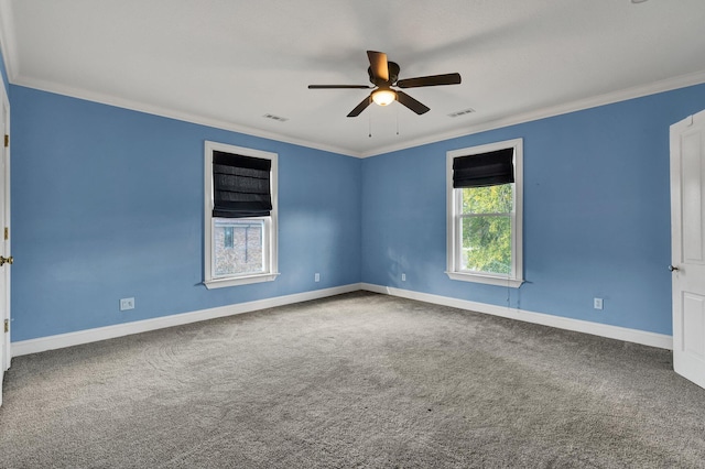 carpeted empty room with ceiling fan and ornamental molding