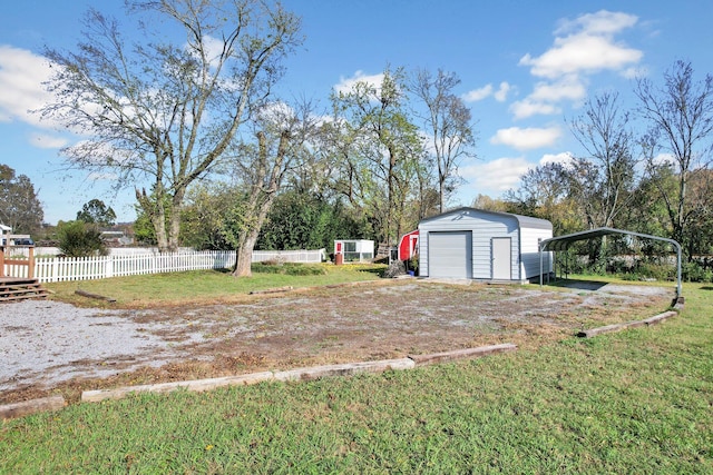 view of yard with an outdoor structure and a carport