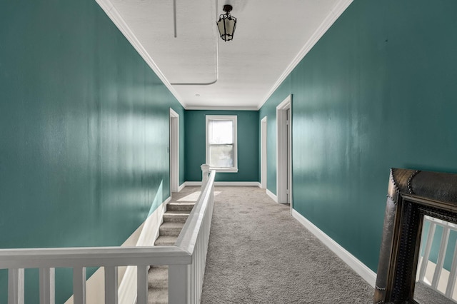 hall with carpet and ornamental molding