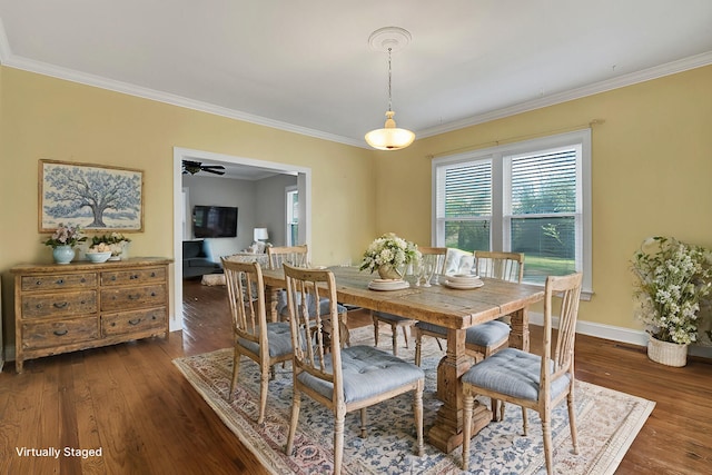 dining area featuring ceiling fan, dark wood-type flooring, and ornamental molding