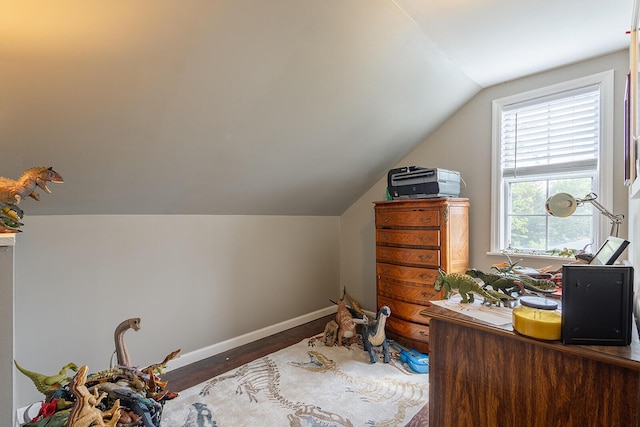 office area with lofted ceiling, wood finished floors, and baseboards