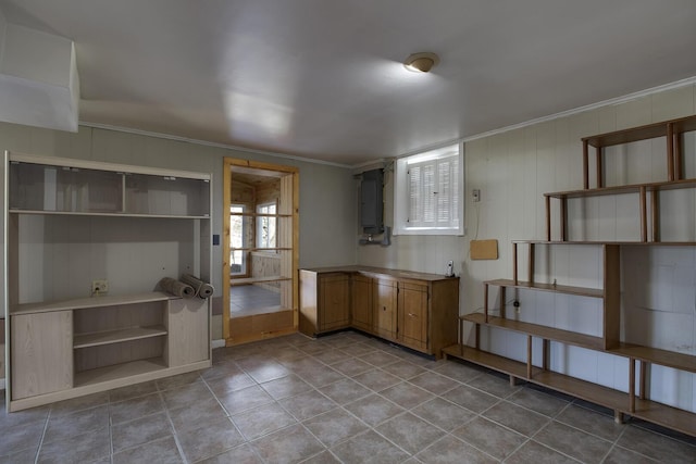 kitchen with light tile patterned floors, open shelves, and ornamental molding