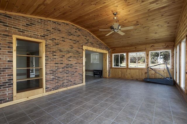 unfurnished sunroom with lofted ceiling, ceiling fan, and wooden ceiling