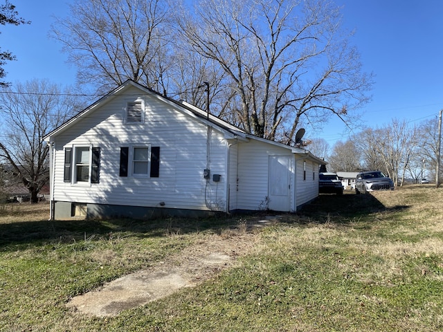 view of property exterior featuring a yard