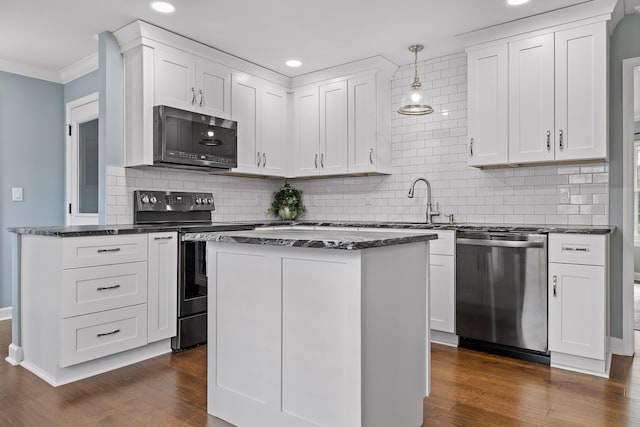 kitchen with white cabinets, pendant lighting, dark hardwood / wood-style flooring, and stainless steel appliances