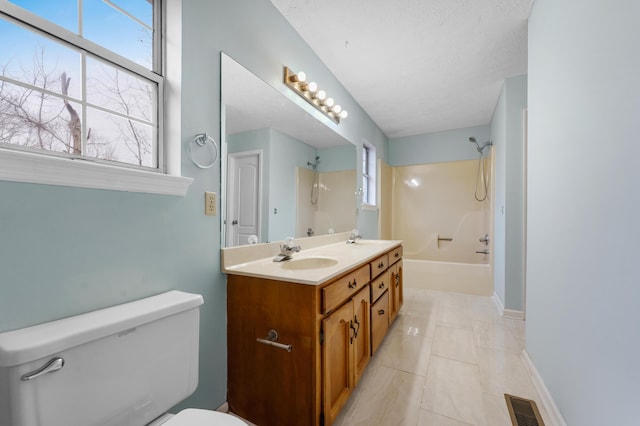 full bathroom featuring shower / tub combination, tile patterned flooring, vanity, toilet, and a textured ceiling