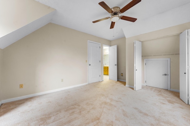 additional living space featuring ceiling fan, lofted ceiling, and light carpet