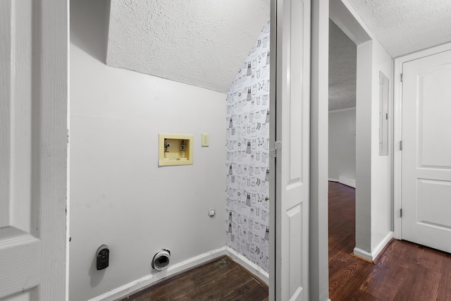 laundry area with gas dryer hookup, dark wood-type flooring, hookup for a washing machine, and a textured ceiling