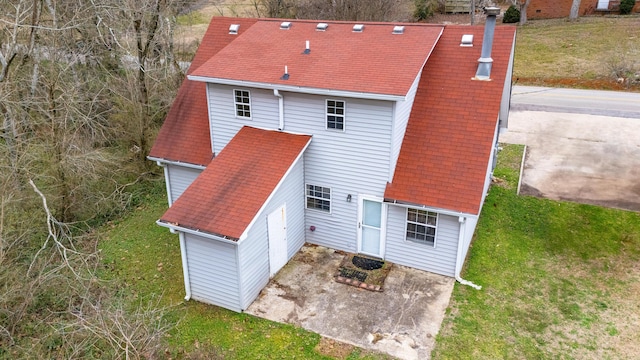 rear view of house with a lawn