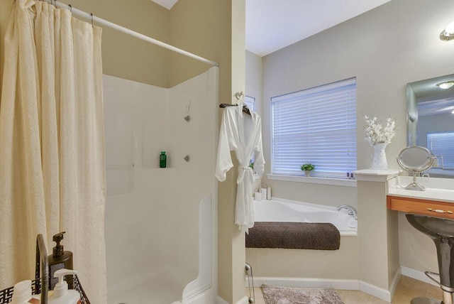 full bath with tile patterned flooring, a garden tub, and a shower stall