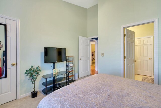 bedroom featuring carpet floors and baseboards