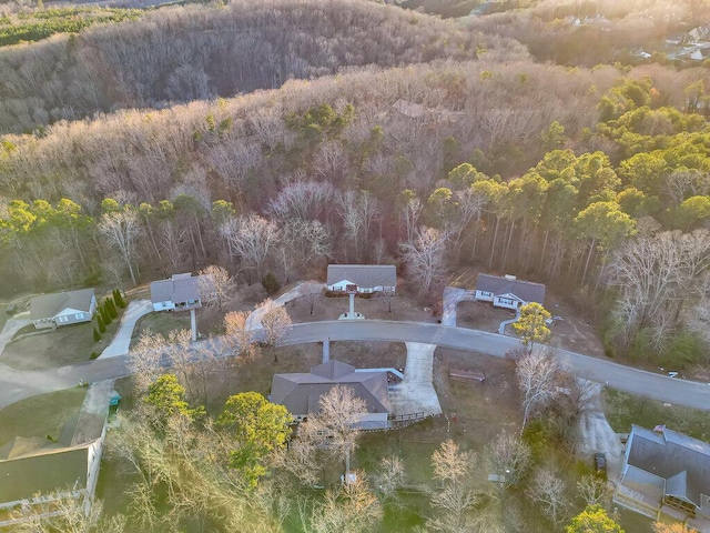 drone / aerial view featuring a view of trees