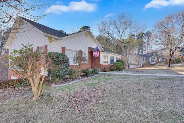 view of property exterior with brick siding