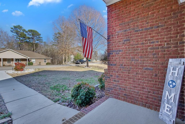 view of property exterior with brick siding