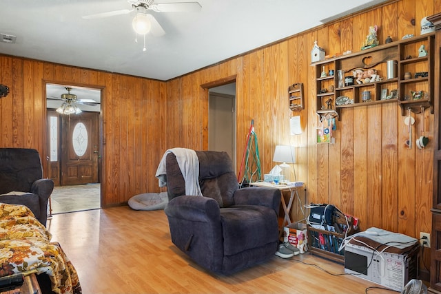 9712 Birchwood Pike, Harrison, TN 37341 - living area featuring light wood finished floors, a ceiling fan, and wood walls